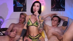 Naughty Tattooed Chick Gives BJ to Two Guys