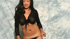 Desirable Oriental chick Fifi shows off the sexy curves of her body