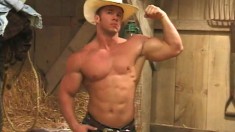 Beefy cowboy flexes and whips out his cock to give it a few strokes