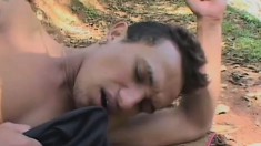 Handsome twink blows a dick and gets his ass fucked hard in the forest